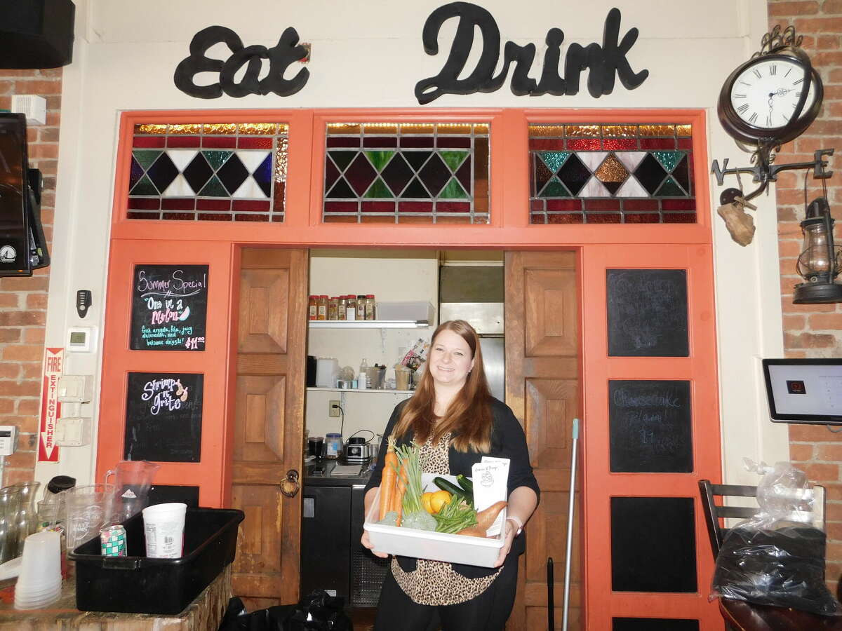 Sara Roberts operates Greens N Things, a virtual restaurant that offers meals she delivers to customers up to five days a week. She is seen here at Sawyer’s Restaurant & Bar on Center Street in Torrington, where she rents kitchen space.