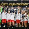 FILE - Washington Spirit players celebrate after defeating Chicago Red Stars in the NWSL Championship soccer match Saturday, Nov. 20, 2021, in Louisville, Kentucky. An independent investigation into the scandals that erupted in the National Women's Soccer League last season found emotional abuse and sexual misconduct were systemic in the sport, impacting multiple teams, coaches and players, according to a report released Monday, Oct. 3, 2022.