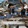 Hurricane Ian damage in Matlacha, Fla. The catastrophe modeling firm Karen Clark & Co. estimates that total damage from the storm could exceed $100 billion, with private insurance carriers on the hook for $63 billion. (AP Photo/Gerald Herbert)