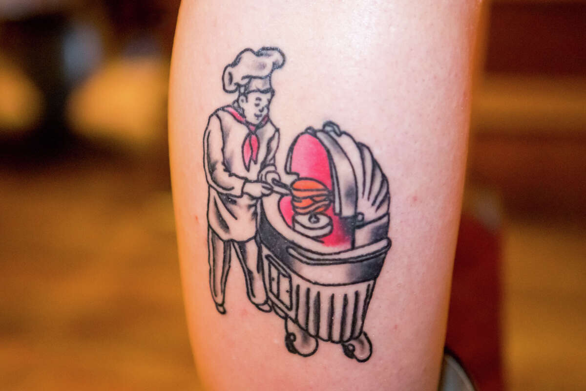 Kelsey Kowalski's House of Prime Rib tattoo, photographed in the restaurant's dining room, on Sept. 30, 2022.