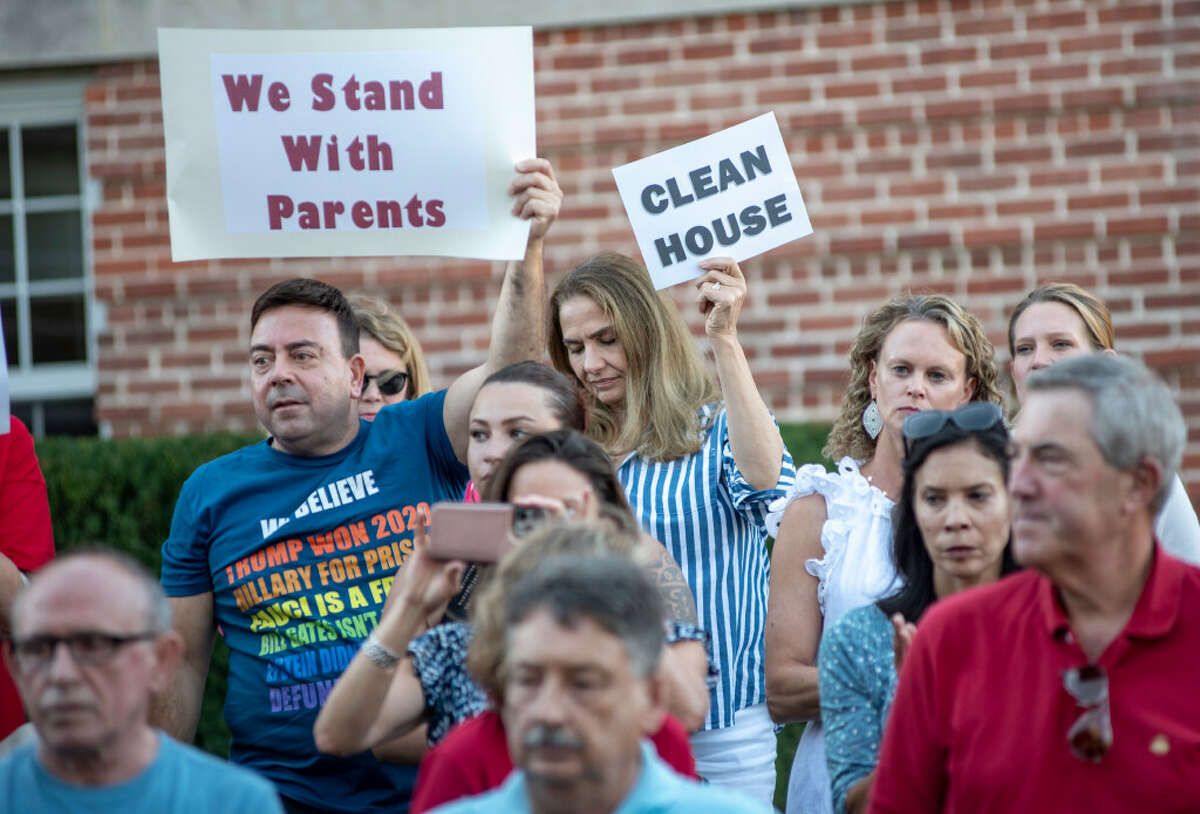 Protestors took part in a press conference last month outside of Cos Cob School after video clips were released of the school's assistant principal allegedly claiming there were discriminatory hiring practices in effect in the district.