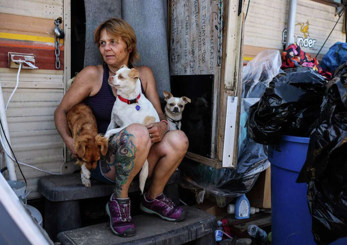 Sandy Hill who lives in an RV at an encampment along Rydin Road takes a break from gathering her belongings before being evicted by the city of Richmond, California on Friday, Sept. 30, 2022.