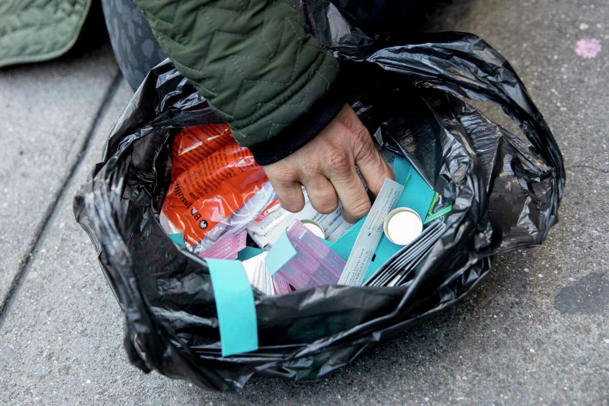 San Francisco could turn to hydromorphone to curb opioid deaths. A homeless woman named Courtneysifts through her bag of Fentanyl-smoking paraphernalia while sitting along Turk Street in San Francisco, Calif. Wednesday, Jan. 22, 2020.