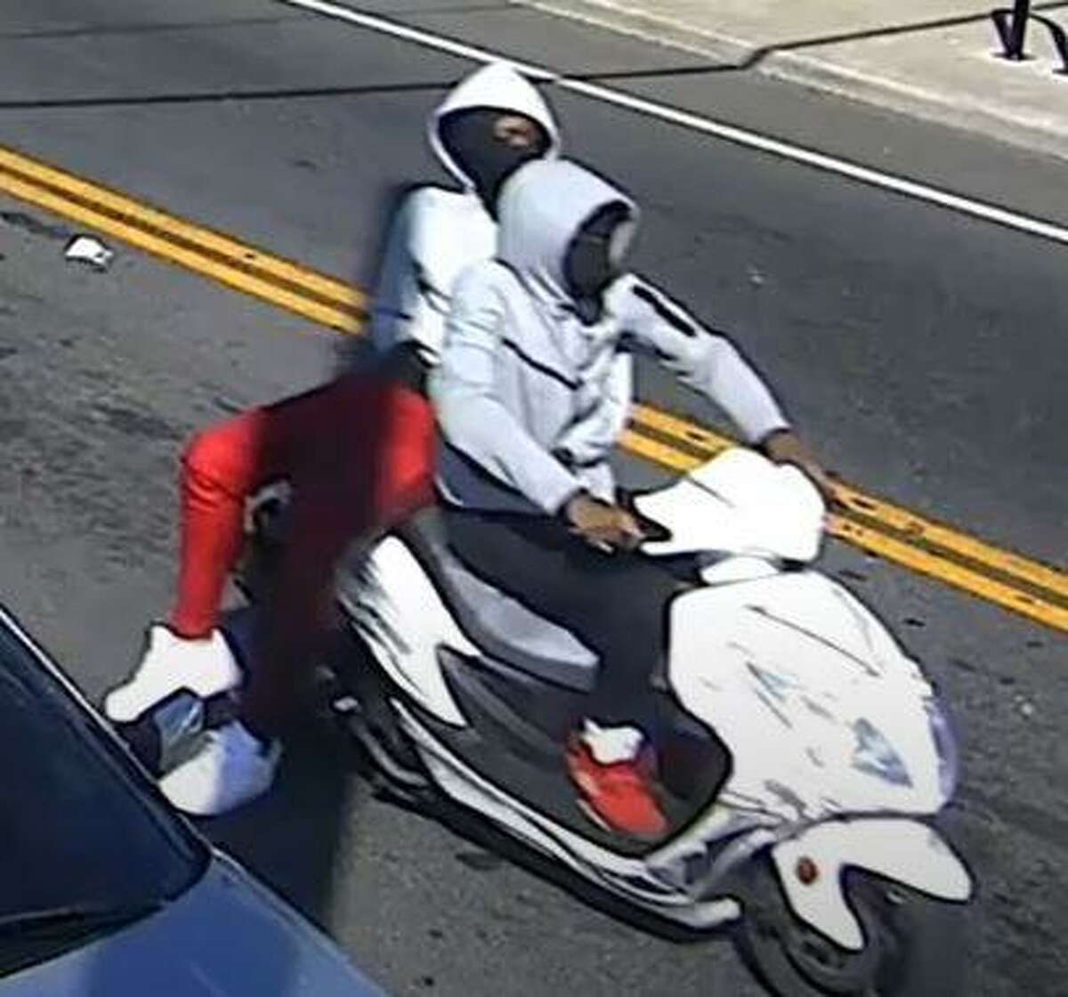 Bridgeport police said video footage, include this image of the suspects fleeing on a scooter, helped lead to three arrests in a double-homicide at a local gas station over the summer.