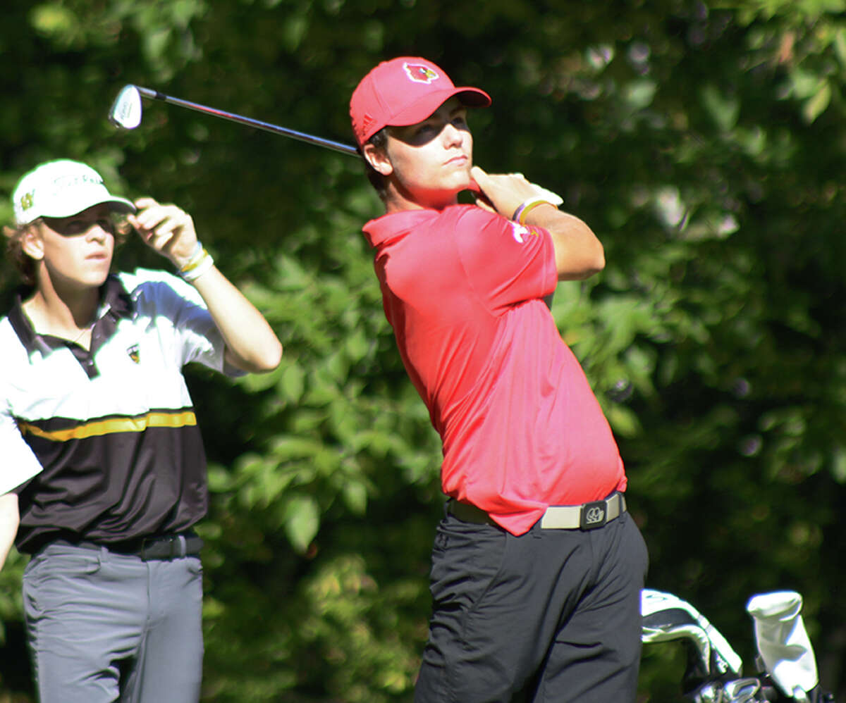 Alton sophomore Sam Ottwell (right) watches his shot during the O'Fallon Class 3A Sectional on Monday at Stonewolf golf course in Fairview Heights. Ottwell shot 72 to finish second and advance to this weekend's state tourney in Bloomington.