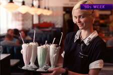 Waitress Shablis Shipley delivers a tray of various milkshake flavors at 59 Diner.