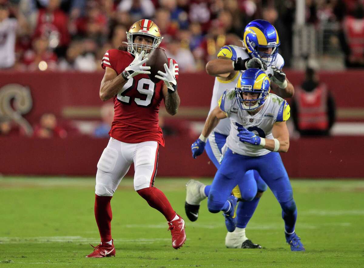 Talanoa Hufanga (29) intercepts a ball intended for Cooper Kupp (10) in the fourth quarter as the San Francisco 49ers played the Los Angeles Rams at Levi’s Stadium in Santa Clara, Calif., on Monday, October 03, 2022.