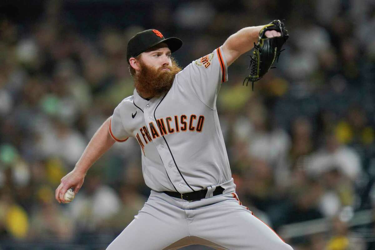 Giants reliever John Brebbia, shown pitching in a game last season, is struggling to adjust to the new pitch clock so far in spring training.