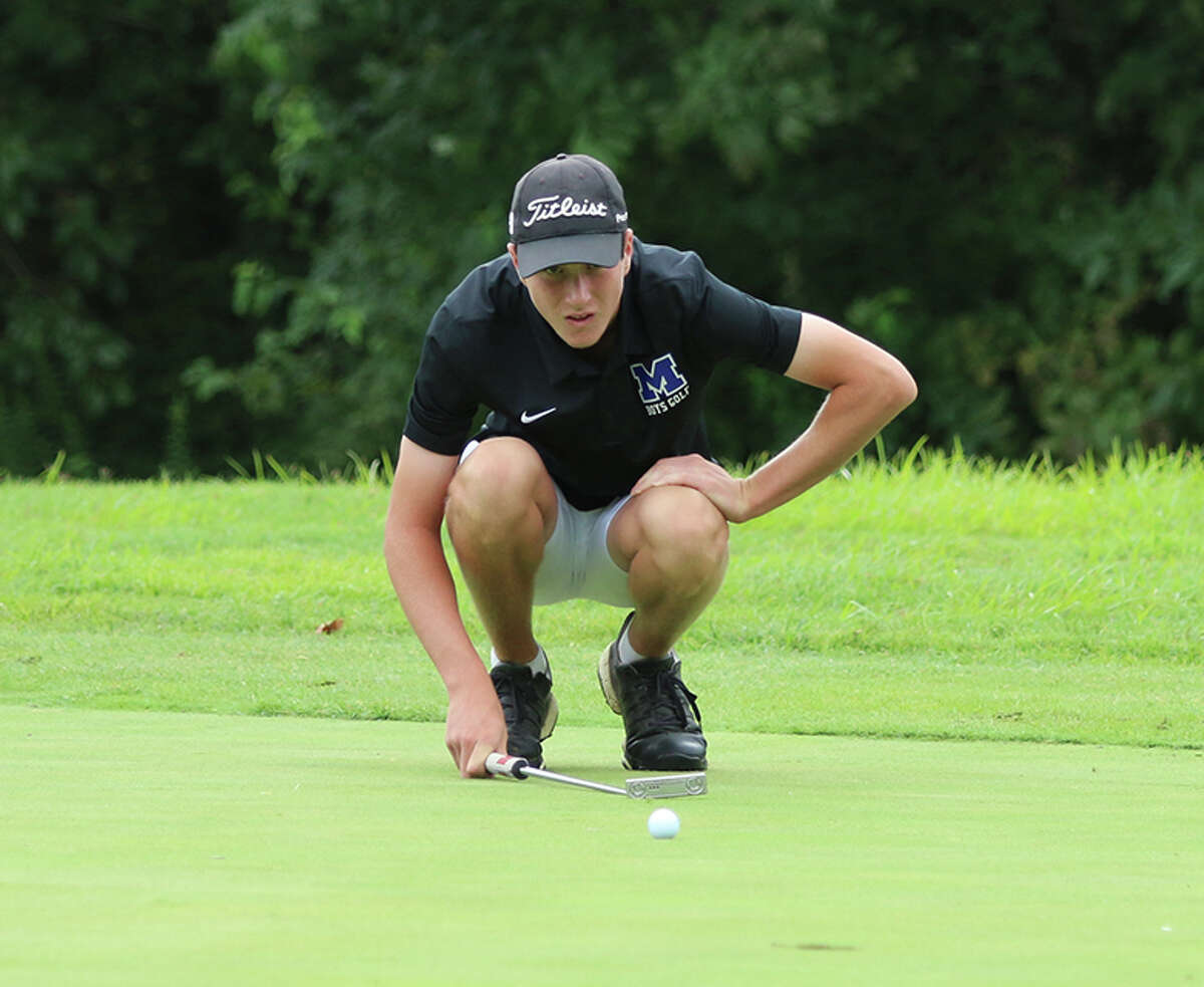 Marquette Catholic's Aidan O'Keefe lines up a putt during a tourney earlier this season at Belk Park in Wood River. O'Keefe shot 80 on Monday at Effingham St. Anthony Class 1A Sectional to lead the Explorers to a state tournament berth.