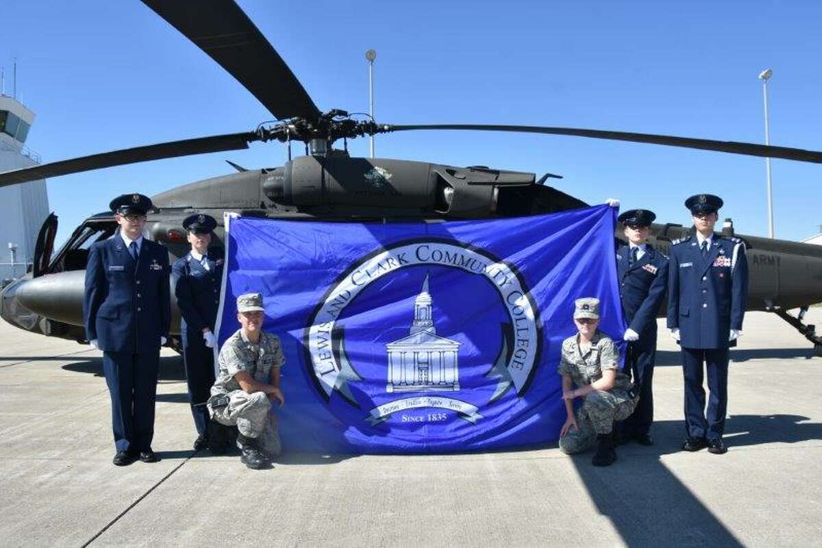Cadets from the IL-286th Composite Squadron display the Lewis and Clark Community College flag in front of a UH-60 Black Hawk helicopter at the St. Louis Regional Airport’s 26th Annual Fly-In to commemorate the recent joint effort of the squadron and the LCCC Veterans Club. Pictured left to right: Cadet/SMSgt Johnson, Cadet/CMSgt Gusewelle, Cadet/CMSgt Pelletier, Cadet/1st Lt Gusewelle, Cadet/2d Lt Malson, Cadet/2d Lt Perham. Photo was taken by Cadet/CMSgt Monheiser (PAO, IL-205th)