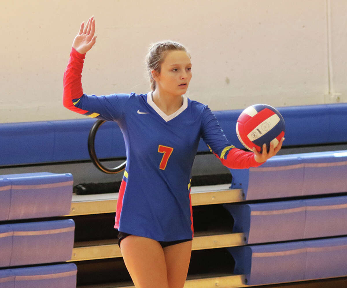 Roxana's Peyton Petit, shown serving in a match earlier this season at Roxana, was back home Monday and had seven kills in a Cahokia Conference loss to Breese Central.