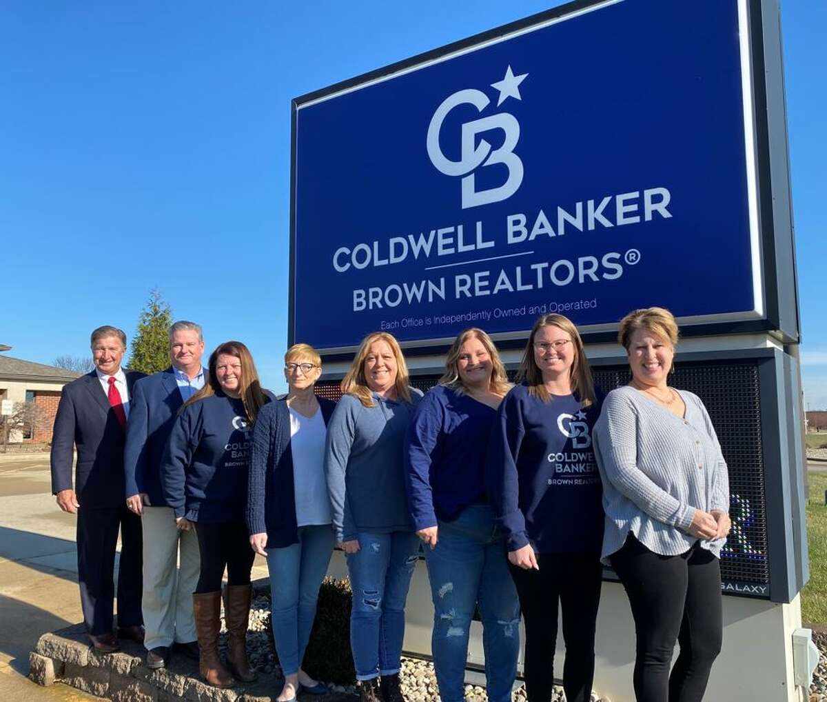 Coldwell Banker Brown Realtors has given back to 35 businesses and charities in celebration of its 50th Anniversary. From left are Gerry Schuetzenhofer, John McNamara, Jen Wolf, Elizabeth Robinson, Tracy Cameron, Jamie Budwell, Kourtney Green and Amy McGarr.