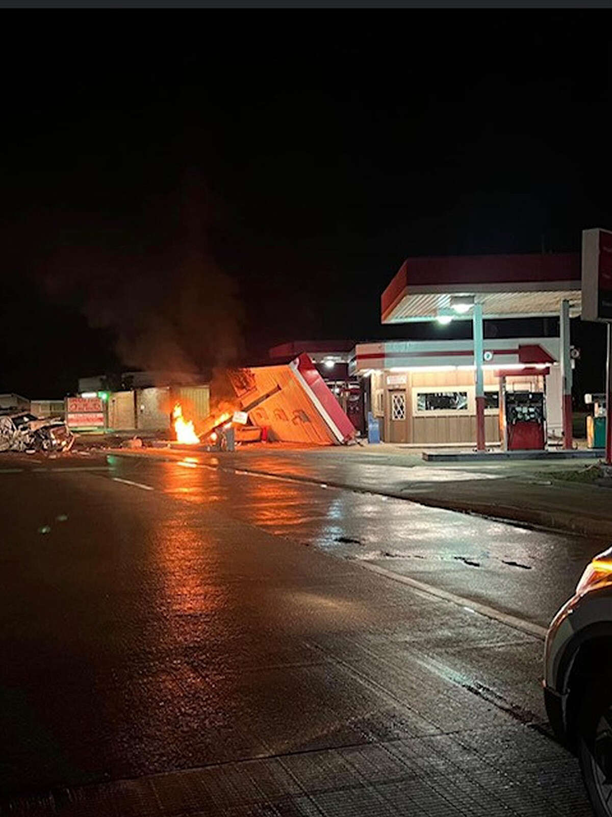 This photo was taken shortly after the vehicle plowed into the full-service pumps knocking them down and the awning. The fire was extinguished by Crosby firefighters shortly after.