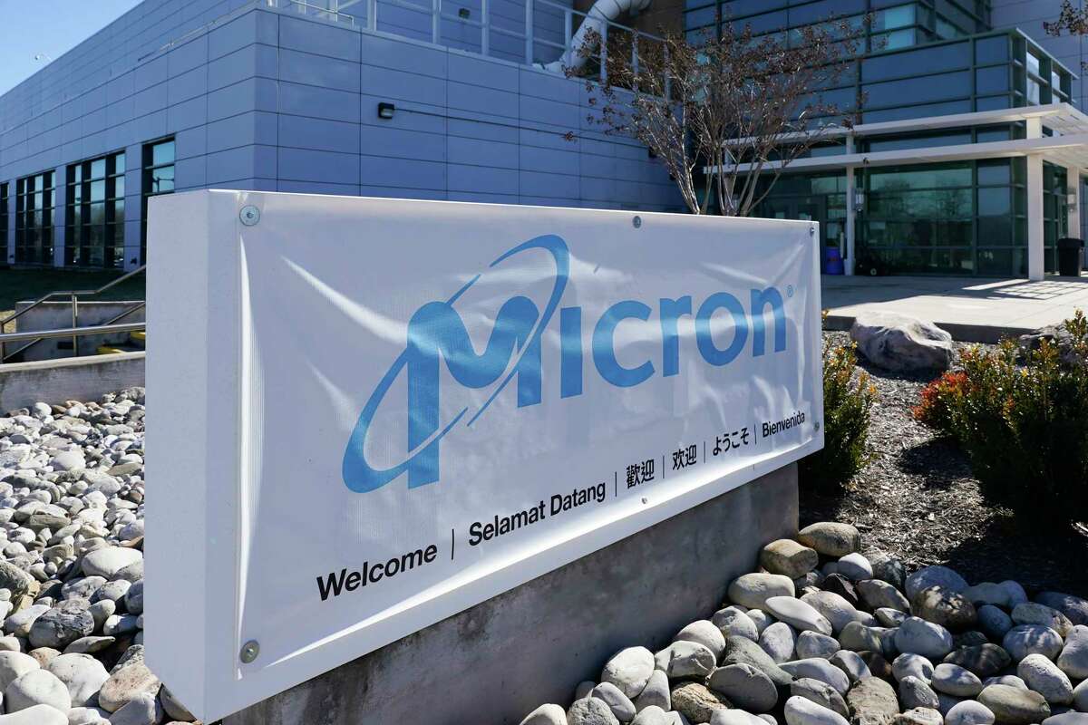 FILE - A sign marks the entrance of the Micron Technology automotive chip manufacturing plant on Feb. 11, 2022, in Manassas, Va. Micron, one of the world’s largest microchip manufacturers, is expected to open a semiconductor plant in New York, promising a $100 million investment and a plant that could bring 50,000 jobs to the state. Senate Majority Leader Charles Schumer confirmed the company's plan to The Associated Press after speaking to its leaders. (AP Photo/Steve Helber, File)