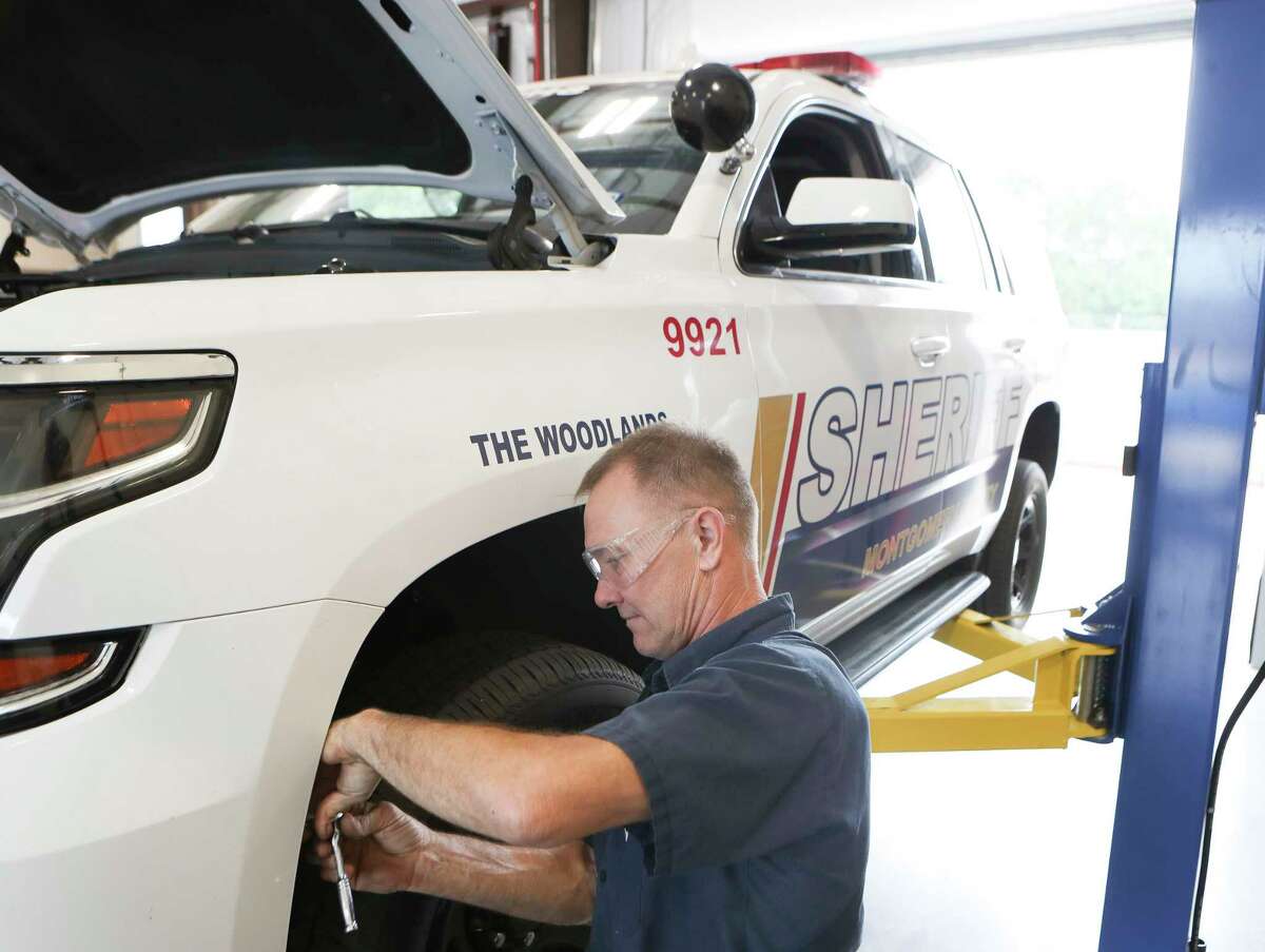 Service technician Bert Devo works on a Montgomery County Sheriff's Office SUV at the agency’s new fleet vehicle maintenance facility, Tuesday, Oct. 4, 2022, in Spring. The facility will house patrol and detective personnel, as well as a new