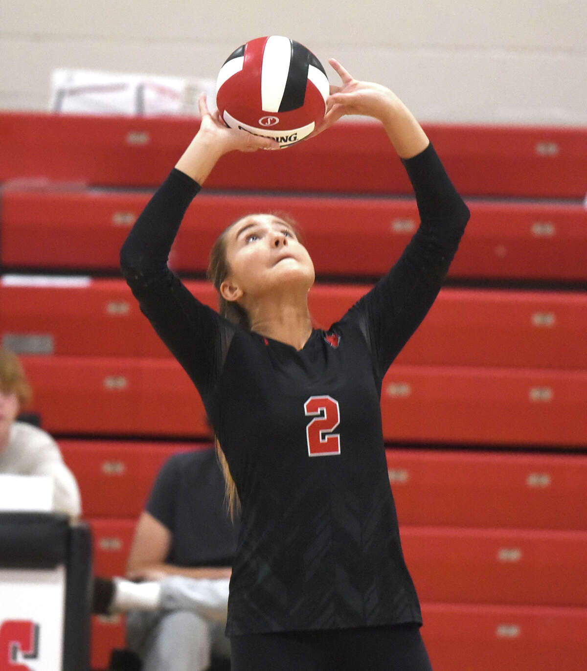 New Canaan senior setter Olivia Zaorski sets the ball during the Rams' volleyball match against Wilton in New Canaan on Thursday, Sept. 29, 2022.