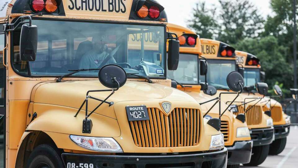 A bus driver is seen before a route starts at the Conroe ISD Oak Ridge Transportation Center, Tuesday, Oct. 4, 2022, in Oak Ridge North. The district's transportation department is one of the areas that are seeing the strain of the district's explosive growth in students, in addition to the growing bus driver shortage.