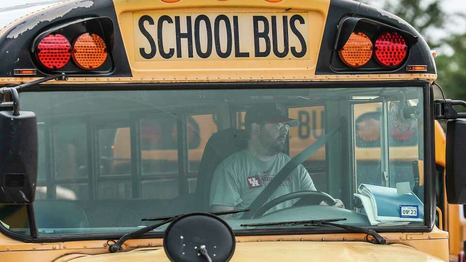 Bus driver Reina Reyes leaves the Conroe ISD Oak Ridge Transportation Center to pick up students, Tuesday, Oct. 4, 2022, in Oak Ridge North. The district's transportation department is one of the areas that are seeing the strain of the district's explosive growth in students, in addition to the growing bus driver shortage.