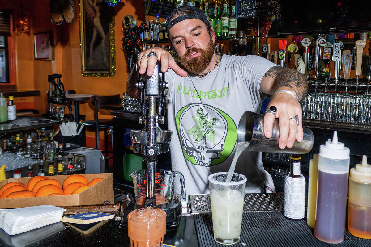 Bartender Damon Lockaby pours a 16oz. Mission Margarita, one of the many signature cocktails at The Casanova Lounge in the Mission District including also the greyhound with freshly squeezed grapefuit juice to the left, as seen on Sept. 19, 2022.