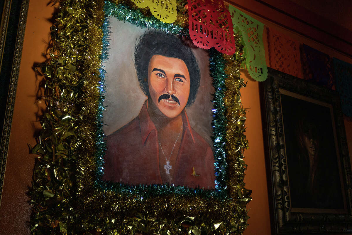 Mr. Casanova, one of many in the '70s portrait collection of The Casanova Lounge, plays the part of the unofficial mascot of the Mission District bar, as seen on Monday evening, Sept. 19, 2022.