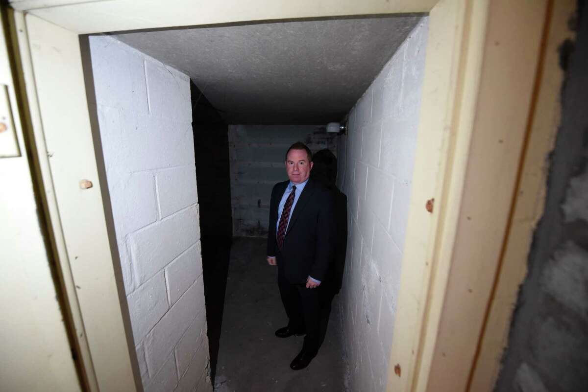 Homeowner Brian Sinkoff stand in the doorway of a basement bomb shelter that came with the 1950s house on Friday, Sept. 30, 2022, in Slingerlands, N.Y.