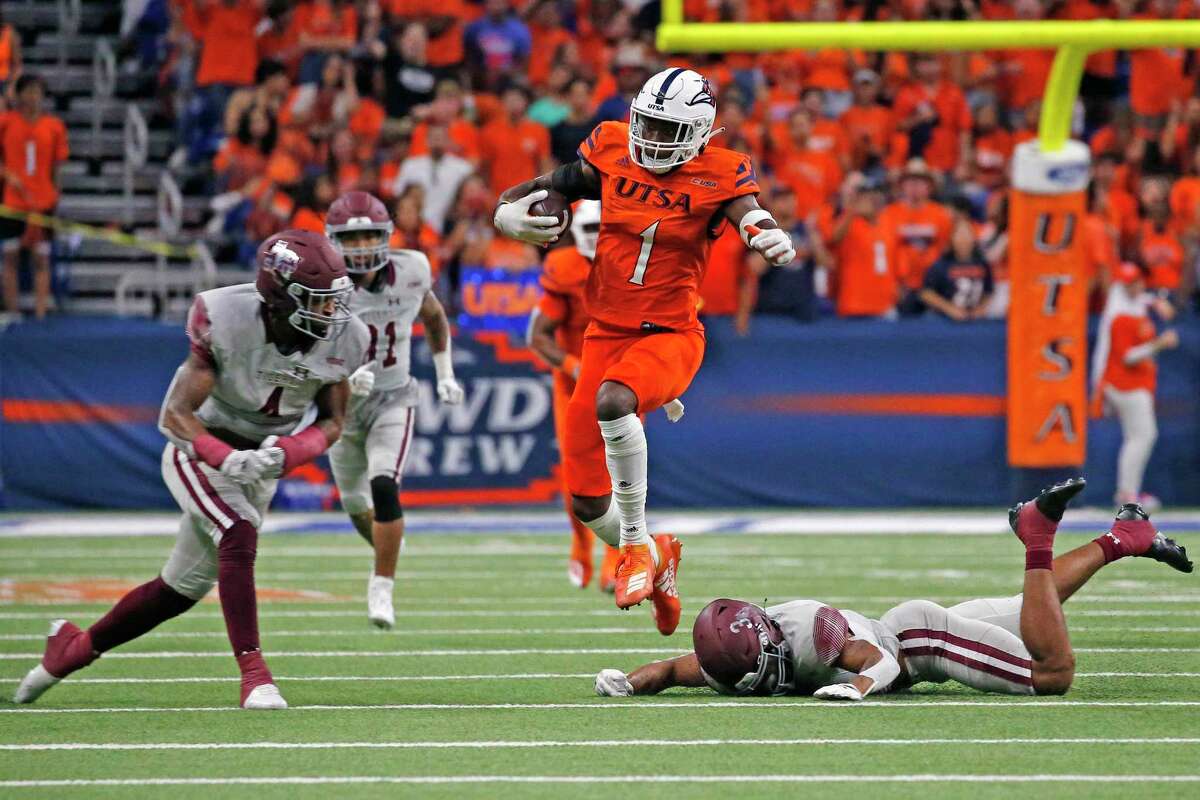 SAN ANTONIO, TX - SEPTEMBER 24: Wide receiver DeCorian Clark #1 of the UTSA Roadrunners leaps over Texas Southern Tigers defenders after reception at the Alamodome on September 24, 2022 in San Antonio, Texas.(Photo by Ronald Cortes/Getty Images)