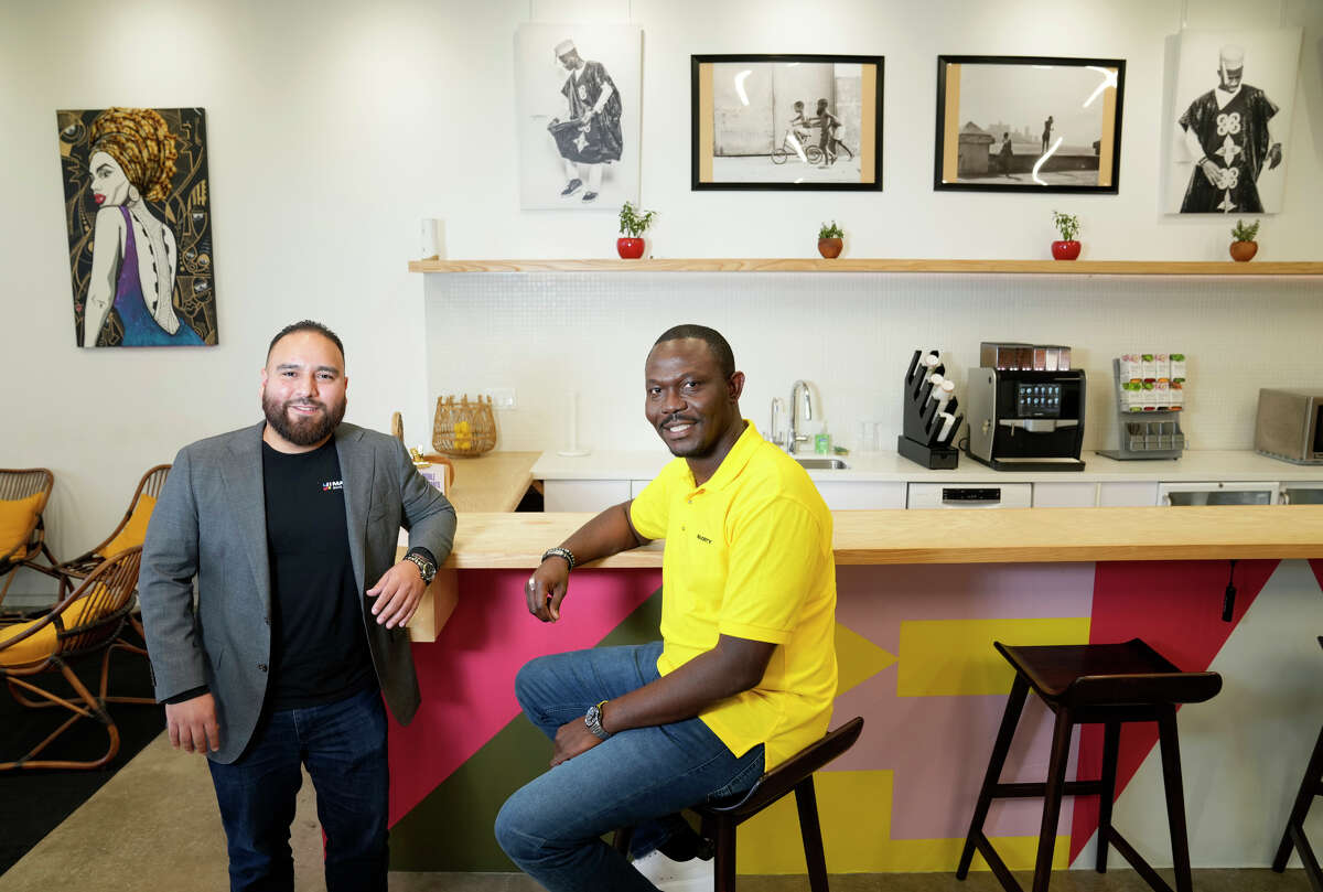 Erasmo Sanchez, left, head of customer service, left, and Femi Moito, head of sales, right, are shown at Majority, 9801 Bissonnet St., Tuesday, Oct. 4, 2022, in Houston.
