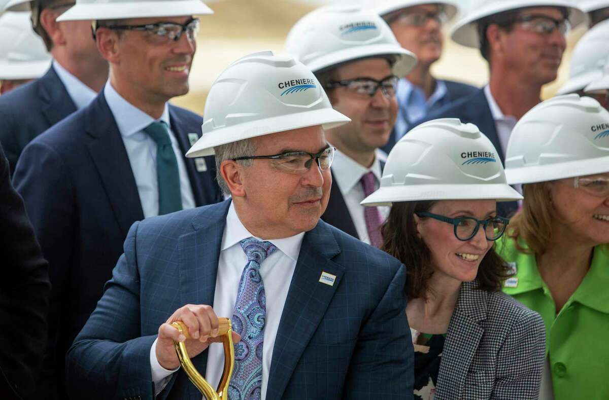 Jack Fusco, President and CEO of Cheniere Energy, poses Tuesday, Oct. 4, 2022 with employees during a groundbreaking ceremony for an expansion project at the company’s Corpus Christi-area liquefied natural gas facility.