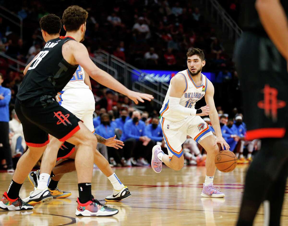 Oklahoma City Thunder guard Ty Jerome (16) looks for an open teammate against the Houston Rockets during the fourth quarter of an NBA game at Toyota Center on Monday, Nov. 29, 2021, in Houston. The Rockets won 102-89.