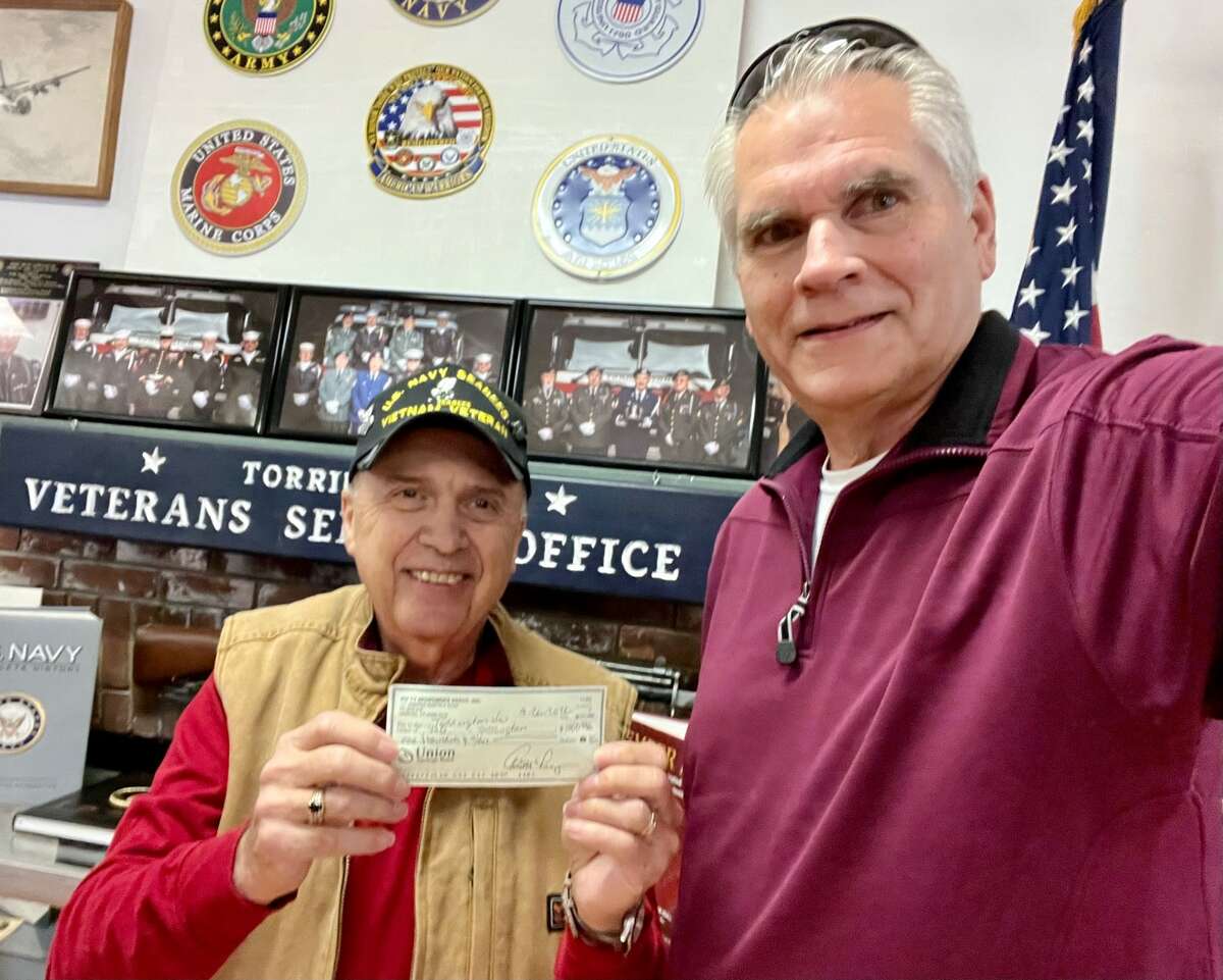 Mike Cracco, a member of Northwestern CT Sportsmen's Association, recently presented Torrington Veterans Service Office Director Michael Thomas with a check for $1,000.