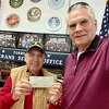 Mike Cracco, a member of Northwestern CT Sportsmen's Association, recently presented Torrington Veterans Service Office Director Michael Thomas with a check for $1,000.