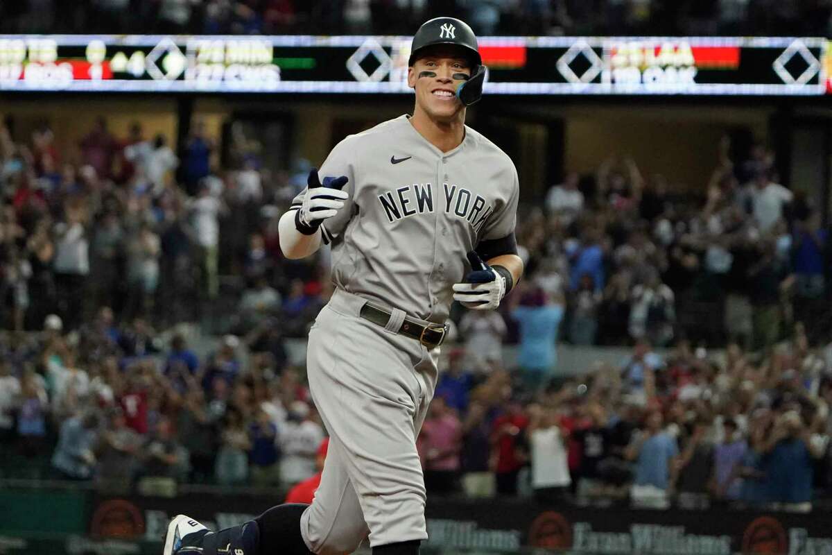 Aaron Judge gestures as he rounds the bases after hitting his record-breaking home run on Tuesday.