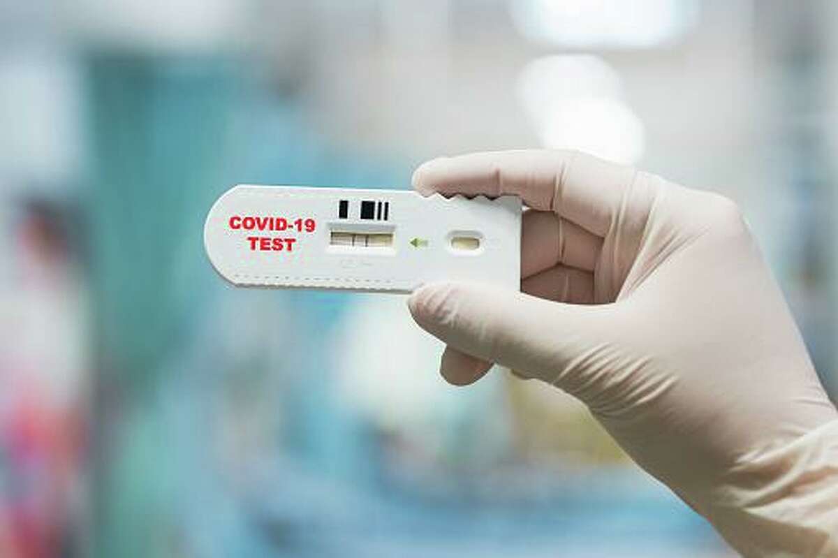 A father and son charged with fraud told investors their company had created a wearable device, using artificial intelligence, that could detect COVID-19 in the person wearing it.