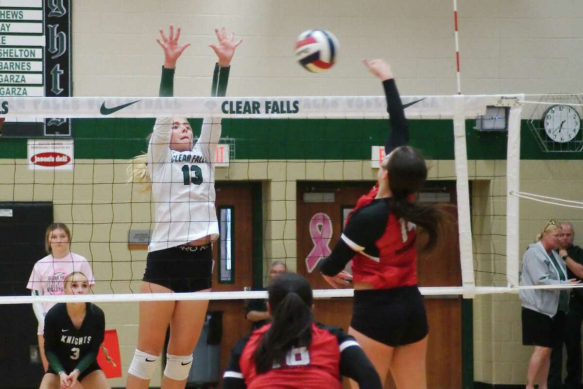Clear Falls’ Haylee Wright (13) tries to block a shot by Clear Brook’s Alisa York (14) Tuesday, Oct. 4, 2022 at Clear Falls High School.