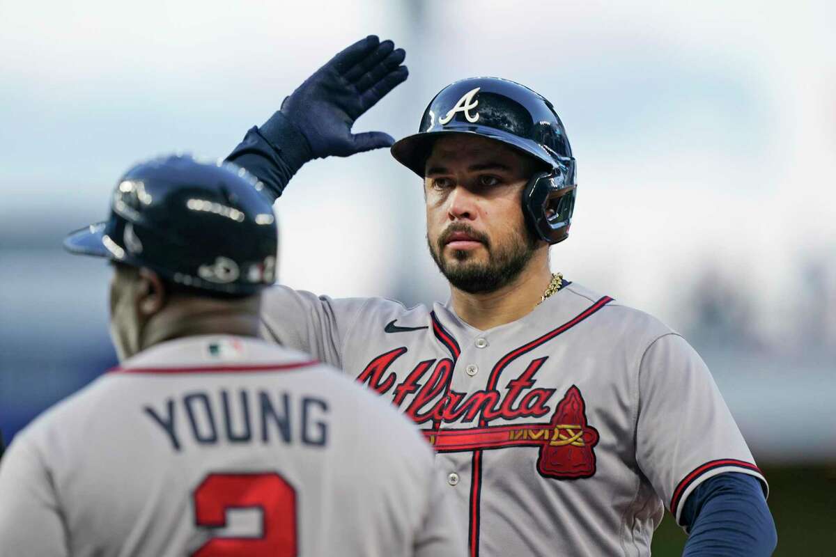 Atlanta Braves' Travis d'Arnaud celebrates after getting a base hit during the first inning of a baseball game against the Miami Marlins, Tuesday, Oct. 4, 2022, in Miami.(AP Photo/Wilfredo Lee)