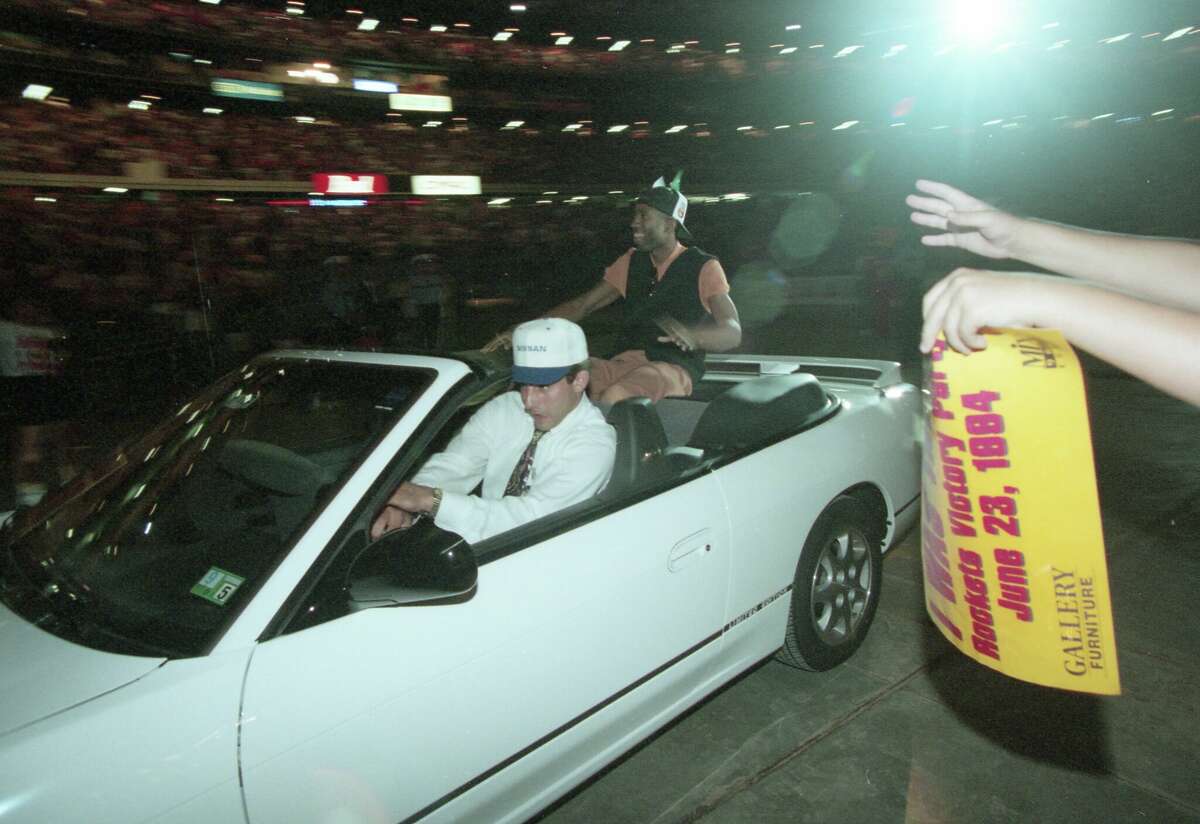 Houston Rockets at their sold-out victory party in the Astrodome Thursday night, June 23, 1994. Nearly 52,000 roaring fans celebrated the Houston Rockets' victory over the New York Knicks for the National Basketball Association championship. Rockets Kenny Smith greets fans as he is driven into the dome.