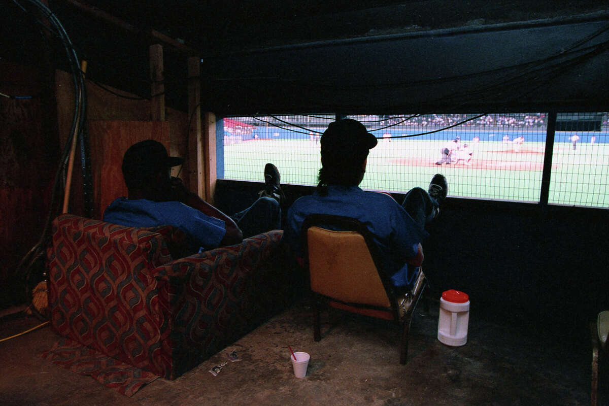 1992: Head groundskeeper Willie Berry, left, watches another game in the Astrodome -- another mess to clean up later.