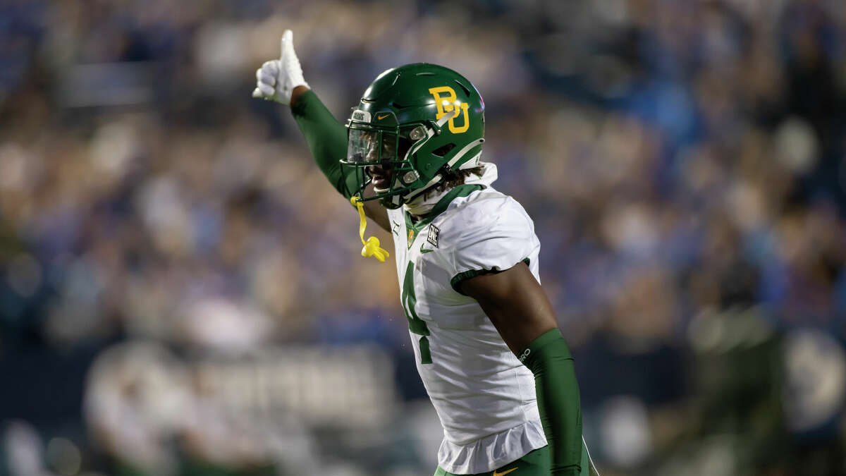 Baylor Bears safety Christian Morgan (4) signals to a teammate on defense during an NCAA football game on Saturday, Sept. 10, 2022 in Provo, Utah. (AP Photo/Tyler Tate)