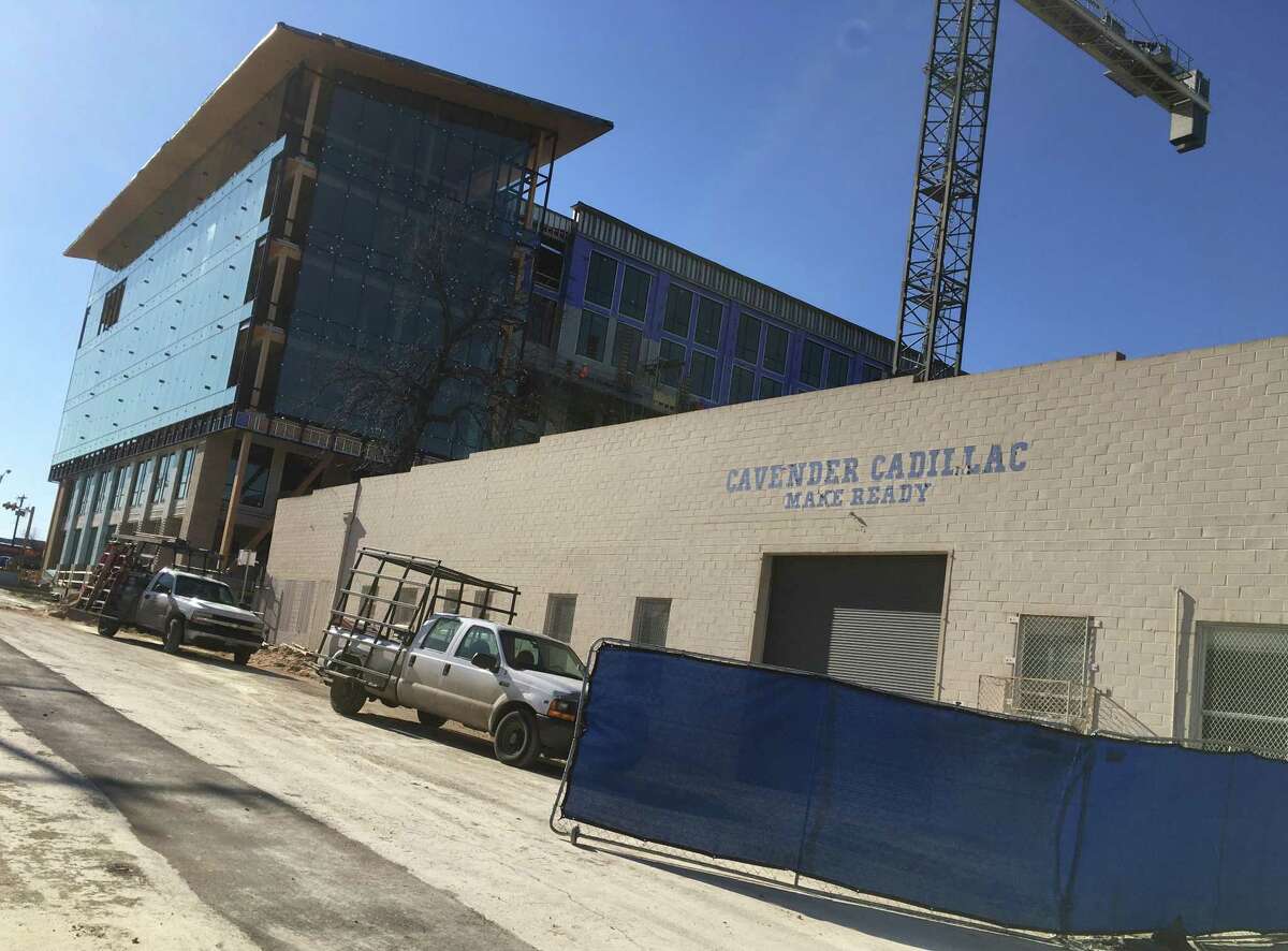 A garage at 203 Eighth Street that served the Cavender Cadillac dealership on Broadway is being converted to a food hall, possibly including a new brewery. It is located behind The Soto (pictured in back), a six-story office and retail complex.