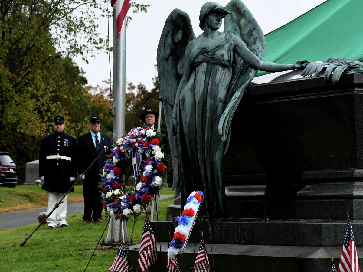 People stand at attention during the annual wreath laying ceremony at the grave of former U.S. President Chester Arthur to celebrate his birthday on Wednesday, Oct. 5, 2022, at Albany Rural Cemetery in Menands, N.Y. President Arthur is the 21st U.S. president. He was born on Oct. 5, 1829.