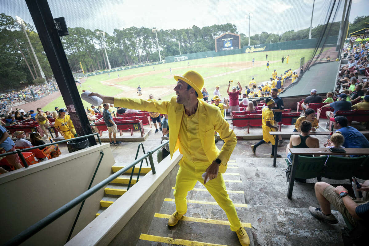 Savannah Bananas owner Jesse Cole takes part in the Banana T-shirt giveaway during the first inning of a game Tuesday, June 7, 2022, in Savannah, Ga. (AP Photo/Stephen B. Morton)