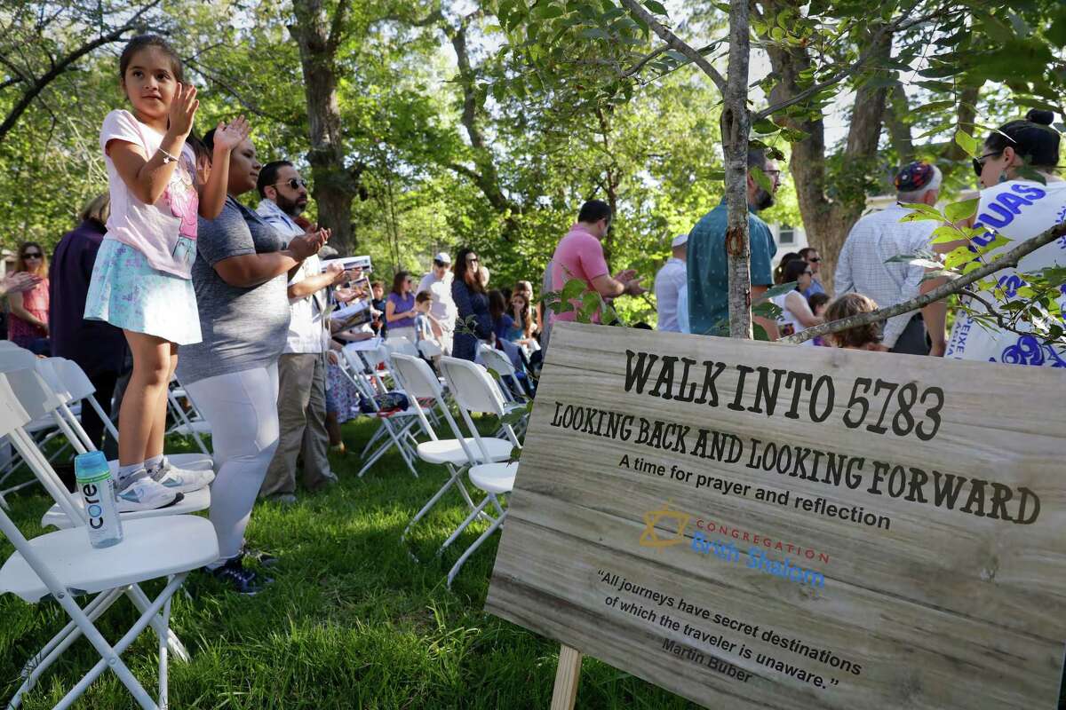 Congregants sing during a service Wednesday in observance of Yom Kippur by members of Congregation Brith Shalom at the Nature Discover Center.