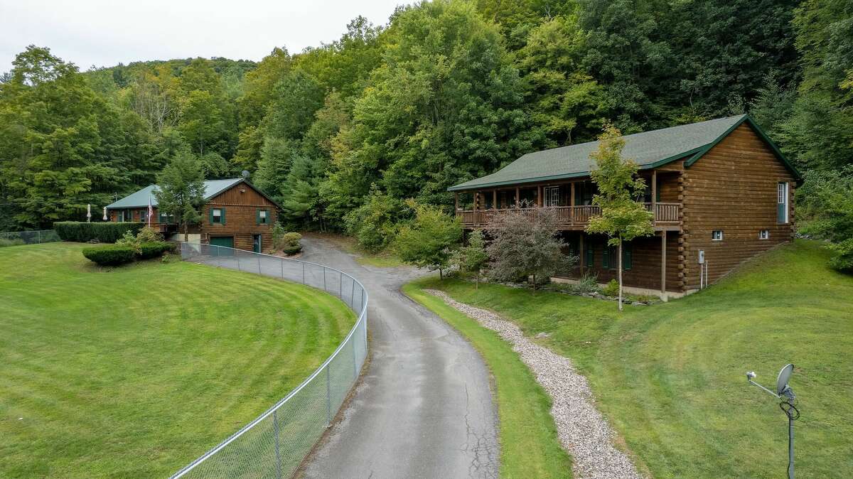 Two log homes for sale in Petersburgh, N.Y.