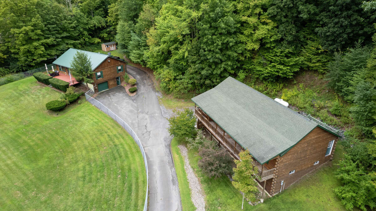 Two log homes for sale in Petersburgh, N.Y.