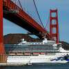 A Princess Cruise Line ship sails under the Golden Gate Bridge in 2020. The city of San Francisco is eseking more than $1 million in damages from Princess Cruise Lines and another company for a 2019 harbor mishap.