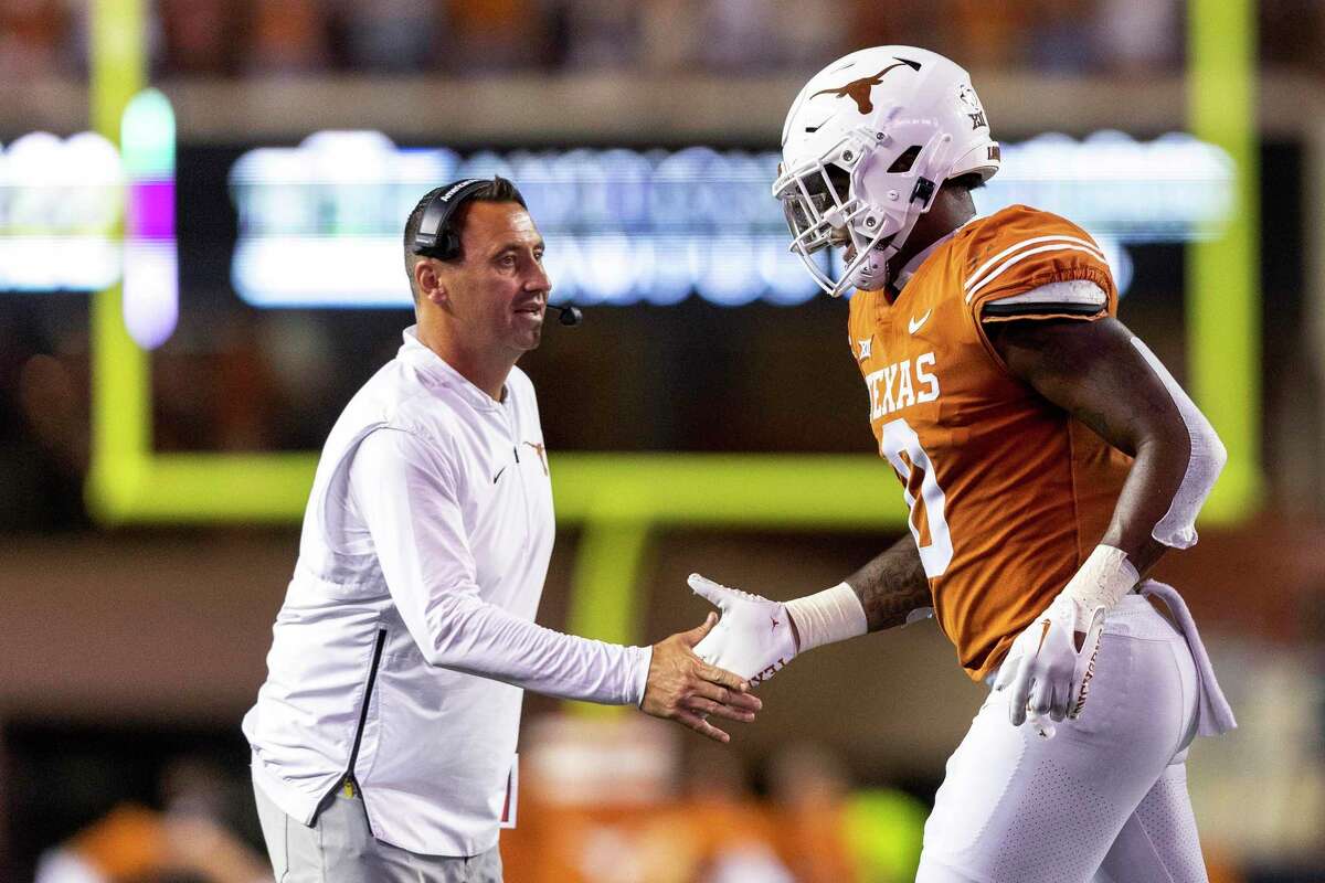 With the help of a touchdown by Ja'Tavion Sanders, right, Texas beat West Virginia to give Steve Sarkisian a 1-1 Big 12 record going into Saturday’s game against an OU team that is 0-2 in the league.