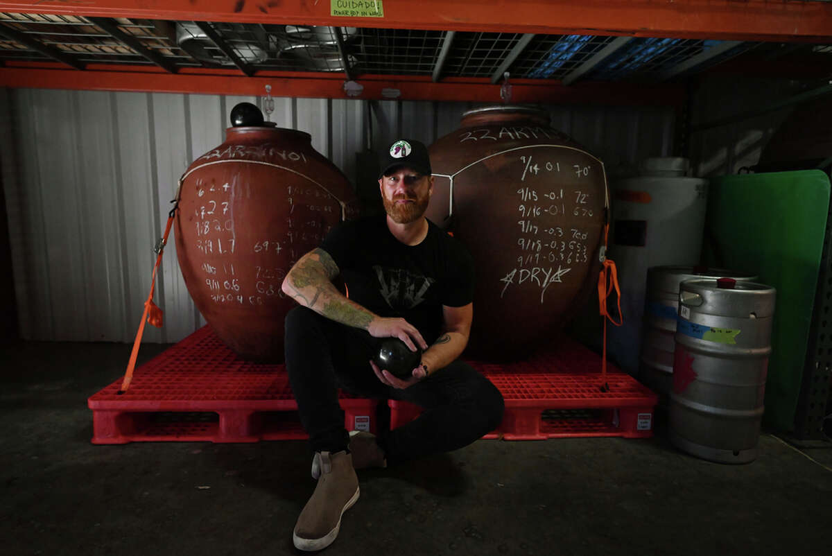 Ardure Wines winemaker Jason Ruppert holds one of his shungite stones, which he places over the tops of his amphora for "an extra layer of protection" from bacteria and electromagnetic fields (EMFs). 