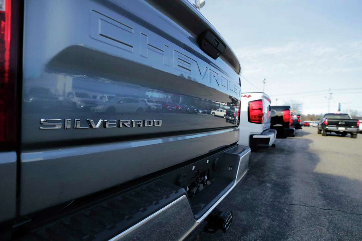 Chevrolet Silverado pick-up trucks are shown on a sales lot in January 2020.
