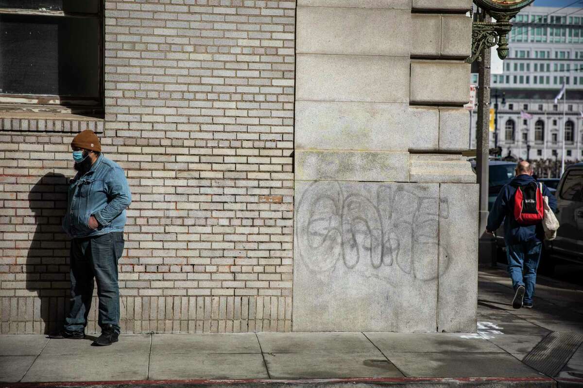 FILE-Anthony Alexander, stands outside the city-run Tom Waddell Urban Health Clinic after he was turned away for the second time in a week for a space at the Joe Healy Detox Program in San Francisco, California Monday, March 15, 2021. Alexander, who is addicted to fentanyl, has been trying to turn his life around.