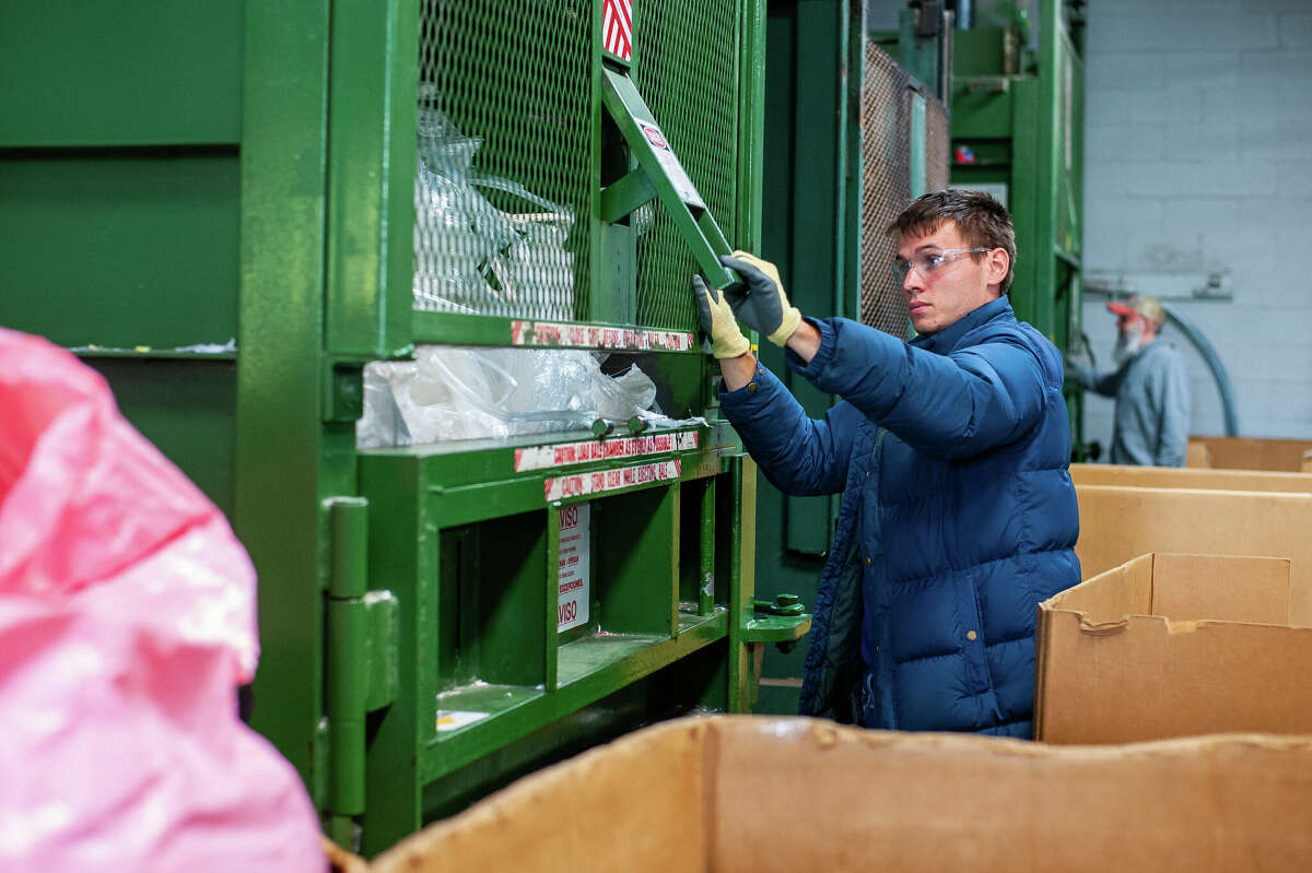 Midland Recyclers employee Stephen Boothroyd operates a baler on Oct. 5, 2022.